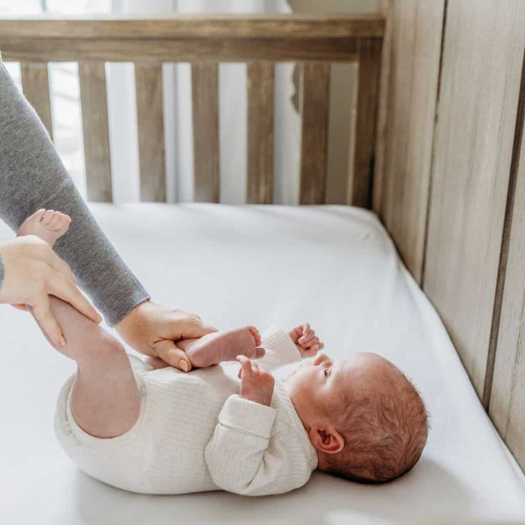 baby in crib bicycle legs for colic