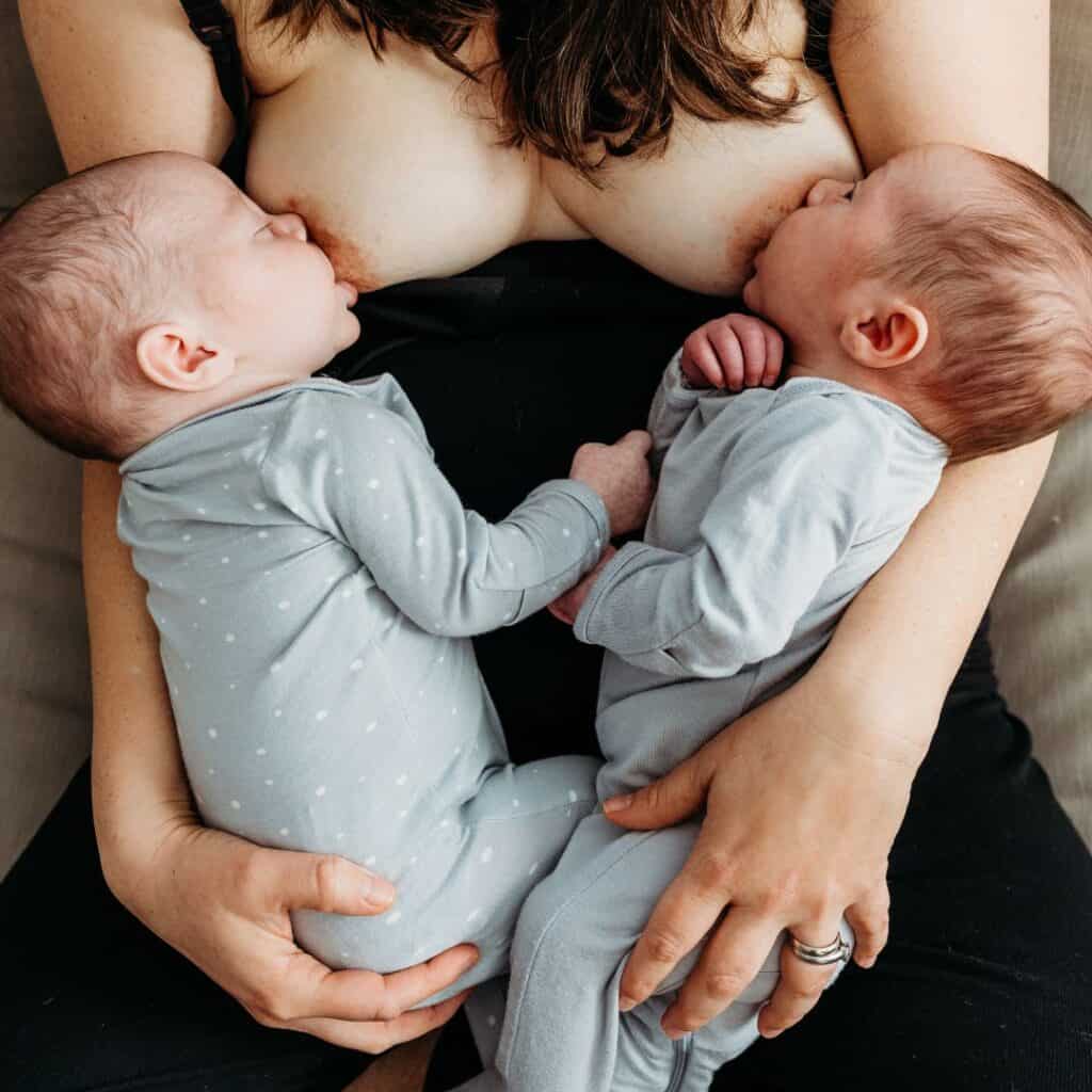 mom breastfeeding twins